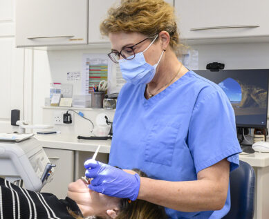 orthodontist treating patient