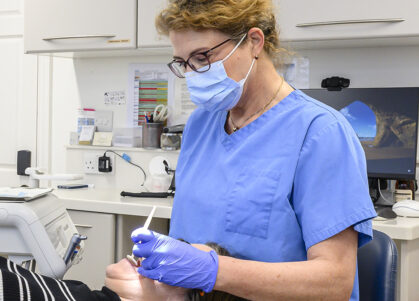 orthodontist treating patient